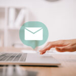 A person with a laptop with an email icon